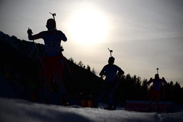 (FILES) Athletes compete during the women's 12.5km mass start event of the IBU Biathlon World Cup in Antholz-Anterselva, Italy, on January 21, 2024. Antholz will host the competition during Milano Cortina 2026 Olympic Games from February 6 to February 22, 2026. (Photo by Marco BERTORELLO / AFP)