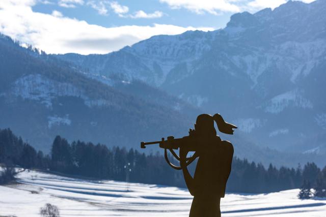 (FILES) A figurine of a biathlete is seen at the entrance to the village of Antholz, northern Italy, the venue for the Olympic Biathlon competitions of the Milano Cortina 2026 Olympic Games, on January 23, 2026. (Photo by Odd ANDERSEN / AFP)