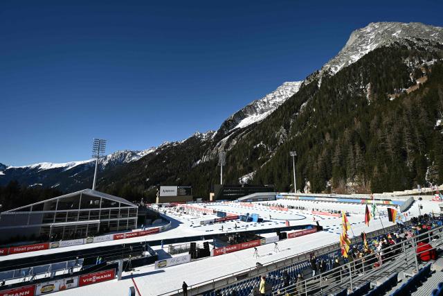 (FILES) A picture shows the Biathlon Arena in Anterselva / Antholz during the IBU Biathlon World Cup on January 24, 2025. Antholz will host the competition during Milano Cortina 2026 Olympic Games from February 6 to February 22, 2026. (Photo by Marco BERTORELLO / AFP)