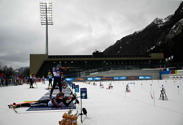 (FILES) Athletes prepare during the zeroing prior the start of the women's 7.5km sprint event of the IBU Biathlon World Cup in Antholz-Anterselva, Italy, on January 23, 2025. Antholz will host the biathlon competitions during Milano Cortina 2026 Olympic Games from February 6 to February 22, 2026. (Photo by Marco BERTORELLO / AFP)