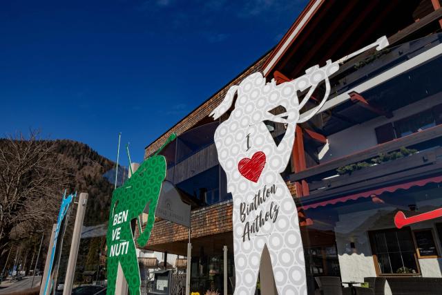 (FILES) Figurines of biathletes are seen at the entrance to the village of Antholz, northern Italy, the venue for the Olympic Biathlon competitions of the Milano Cortina 2026 Olympic Games, on January 23, 2026. (Photo by Odd ANDERSEN / AFP)