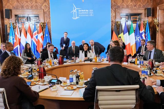 German Economy and Energy Minister Katherina Reiche (C) speaks during opening session of the North Sea Summit in Hamburg, northern Germany, where the North Sea coastal states aim to strengthen cross-border cooperation in the expansion of offshore wind energy and hydrogen infrastructure on January 26, 2026. European leaders and Energy ministers meet in Germany to discuss North Sea energy and security cooperation, but fears over US designs on the Arctic island of Greenland may overshadow the talks. (Photo by Martin Meissner / Pool / AFP)