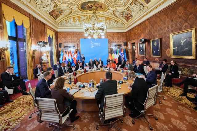 German Economy and Energy Minister Katherina Reiche (C) speaks during opening session of the North Sea Summit in Hamburg, northern Germany, where the North Sea coastal states aim to strengthen cross-border cooperation in the expansion of offshore wind energy and hydrogen infrastructure on January 26, 2026. European leaders and Energy ministers meet in Germany to discuss North Sea energy and security cooperation, but fears over US designs on the Arctic island of Greenland may overshadow the talks. (Photo by Martin Meissner / Pool / AFP)