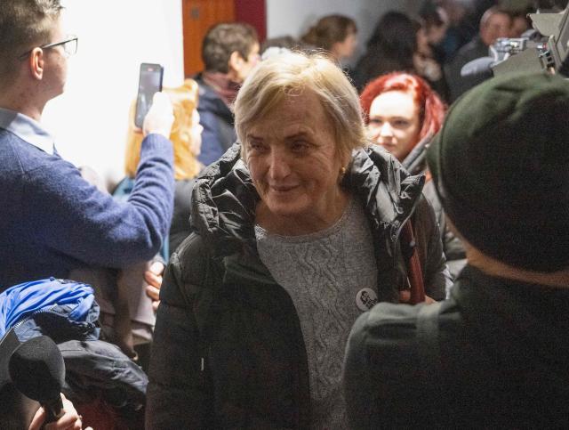 Zlatica Kusnirova (front) mother of Martina Kusnirova, arrives for the retrial of Slovak businessman Marian Kocner (unseen), accused of ordering the killing of journalist Jan Kuciak and his fiancee Martina Kusnirova, is guarded by armed police as he attends a retrial at Slovak Specialized court in Pezinok, Slovakia, on January 26, 2026. Jan Kuciak, a journalist investigating high-level corruption linked to influential businessmen and top politicians, was shot dead with his fiancee, Martina Kusnirova, both 27, at their home in the village of Velka Maca in February 2018. Their deaths sparked the largest protests in Slovakia since the fall of Communism, leading to the resignation of the government of Robert Fico, although the nationalist prime minister returned to power in 2023. (Photo by Joe Klamar / AFP)
