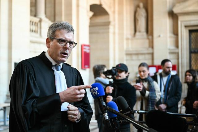 French lawyer of one of the sisters of the victim, Thibault de Montbrial gestures as he speaks to the press during the appeal trial of four people accused of involvement in the jihadist beheading of schoolteacher Samuel Paty in 2020, at the Palais de Justice, Paris' courthouse on January 26, 2026. Samuel Paty, 47, was beheaded in October 2020 by an 18-year-old Islamist radical of Chechen origin after showing cartoons of the Prophet Mohammed in class. His killer, Abdoullakh Anzorov, later died in a shootout with the police. (Photo by Bertrand GUAY / AFP)