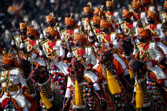 TOPSHOT - Border Security Force's (BSF) camel-mounted contingent marches during the country's 77th Republic Day parade at Kartavya Path in New Delhi on January 26, 2026. (Photo by Sajjad HUSSAIN / AFP)