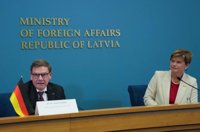 German Foreign Minister Johann Wadephul and Latvian Foreign Minister Baiba Braze give a statement for all Latvian  ambassadors during Wadephul's visit to Latvia on January 26, 2026 at the Foreign Ministry in Riga. (Photo by Gints Ivuskans / AFP)