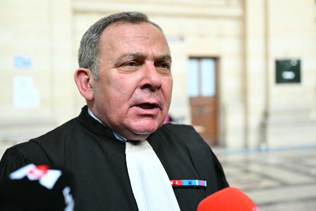 French lawyer Francis Szpiner, lawyer of Samuel Paty's son speaks to the press during a break of the appeal trial of four people accused of involvement in the jihadist beheading of schoolteacher Samuel Paty in 2020, at the Palais de Justice, Paris' courthouse on January 26, 2026. Samuel Paty, 47, was beheaded in October 2020 by an 18-year-old Islamist radical of Chechen origin after showing cartoons of the Prophet Mohammed in class. His killer, Abdoullakh Anzorov, later died in a shootout with the police. (Photo by Bertrand GUAY / AFP)