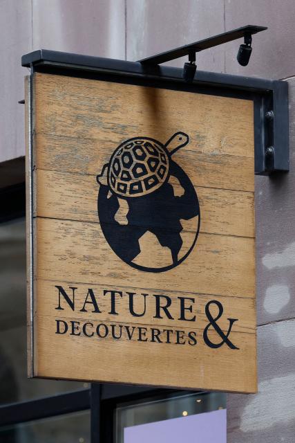 This photograph shows a logo of Nature & Decouvertes French retail chain on a store in Paris on January 26, 2026. Fnac Darty announced on January 26, 2026 that it is seeking to divest itself of the wellness retailer Nature & Découvertes, which it acquired in 2019 but whose difficulties are weighing down the group's accounts. (Photo by Sebastien DUPUY / AFP)