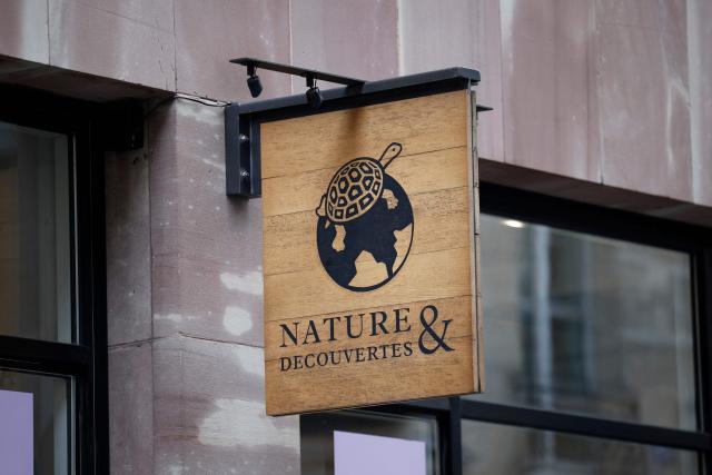 This photograph shows a logo of Nature & Decouvertes French retail chain on a store in Paris on January 26, 2026. Fnac Darty announced on January 26, 2026 that it is seeking to divest itself of the wellness retailer Nature & Découvertes, which it acquired in 2019 but whose difficulties are weighing down the group's accounts. (Photo by Sebastien DUPUY / AFP)