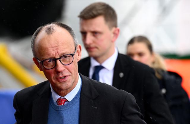 German Chancellor Friedrich Merz (L) arrives to attend the North Sea Summit on January 26, 2026 in Hamburg, northern Germany. European leaders meet to discuss North Sea energy and security cooperation, but fears over US designs on the Arctic island of Greenland may overshadow the talks. The region has long worried about threats posed by Russia -- but more recently tensions have surged over US President Donald Trump's push for the autonomous territory of Denmark. (Photo by Gregor Fischer / AFP)