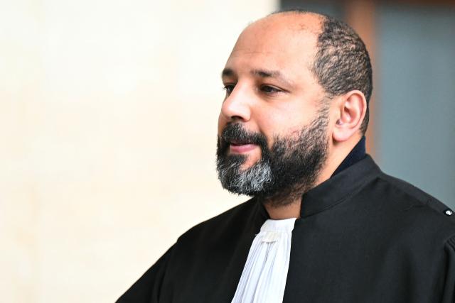 Ouadie Elhamamouchi, lawyer of Abdelhakim Sefrioui looks on during a break of the appeal trial of four people accused of involvement in the jihadist beheading of schoolteacher Samuel Paty in 2020, at the Palais de Justice, Paris' courthouse on January 26, 2026. Samuel Paty, 47, was beheaded in October 2020 by an 18-year-old Islamist radical of Chechen origin after showing cartoons of the Prophet Mohammed in class. His killer, Abdoullakh Anzorov, later died in a shootout with the police. (Photo by Bertrand GUAY / AFP)