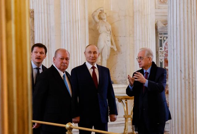 Russian President Vladimir Putin and Malaysia's King Sultan Ibrahim tour the State Hermitage Museum during their meeting in Saint Petersburg on January 26, 2026. (Photo by ANATOLY MALTSEV / POOL / AFP)