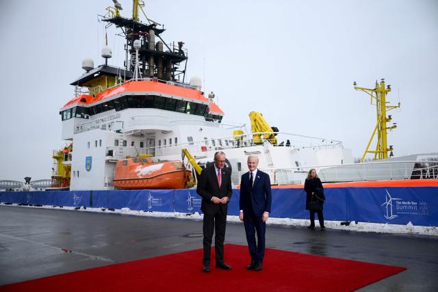 German Chancellor Friedrich Merz (L) welcomes Norway's Prime Minister Jonas Gahr Store as he arrives to attend the North Sea Summit on January 26, 2026 in Hamburg, northern Germany. European leaders meet to discuss North Sea energy and security cooperation, but fears over US designs on the Arctic island of Greenland may overshadow the talks. The region has long worried about threats posed by Russia -- but more recently tensions have surged over US President Donald Trump's push for the autonomous territory of Denmark. (Photo by Gregor Fischer / AFP)