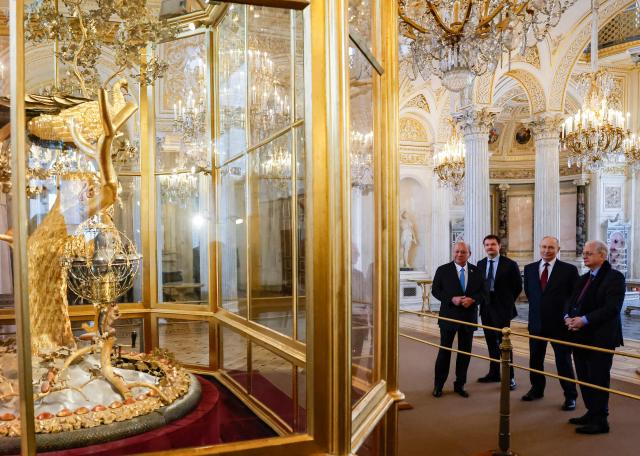 Russian President Vladimir Putin and Malaysia's King Sultan Ibrahim look at the Peacock Clock by James Cox dated from the 1770s, during their meeting at the State Hermitage Museum in Saint Petersburg on January 26, 2026. (Photo by ANATOLY MALTSEV / POOL / AFP)