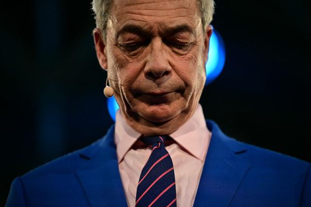 Reform UK leader Nigel Farage pauses for a minutes' silence following a press conference in central London on January 26, 2026, where it was announced that Britain's former Conservative party MP, and former Home Secretary Suella Braverman had defected to the party. (Photo by Ben STANSALL / AFP)