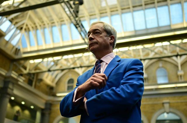 Reform UK leader Nigel Farage reacts ahead of a Reform UK press conference in central London on January 26, 2026, where it was announced that Britain's former Conservative party MP, and former Home Secretary Suella Braverman had defected to the party. (Photo by Ben STANSALL / AFP)