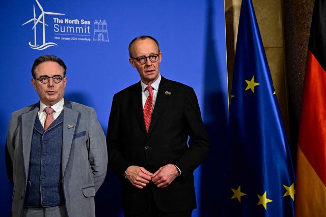Belgium's Prime Minister Bart de Wever (L) and German Chancellor Friedrich Merz pose for a picture prior to a meeting at Hamburg's city hall during the North Sea Summit on January 26, 2026 in Hamburg, northern Germany. European leaders meet to discuss North Sea energy and security cooperation, but fears over US designs on the Arctic island of Greenland may overshadow the talks. The region has long worried about threats posed by Russia -- but more recently tensions have surged over US President Donald Trump's push for the autonomous territory of Denmark. (Photo by Tobias SCHWARZ / AFP)