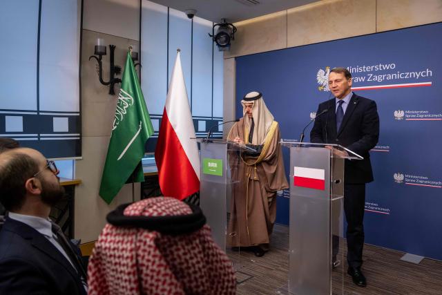 Saudi Arabia's Foreign Affairs Minister Prince Faisal bin Farhan Al Saud (L) and Poland's Foreign Affairs Minister Radoslaw Sikorski (R) give a joint press conference after their meeting at the Foreign Office in Warsaw, January 26, 2026. (Photo by Wojtek RADWANSKI / AFP)