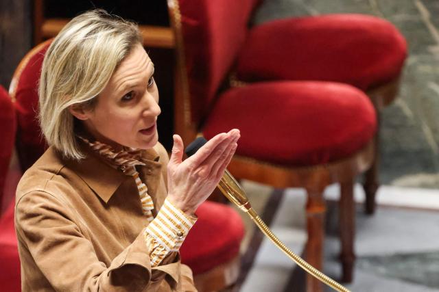 Ensemble Pour la Republique's MP Laure Miller delivers remarks during a parliamentary debate on legislative process for a social media ban on under-15s at the Assemblee Nationale, France's lower house Parliament in Paris on January 26, 2026. French lawmakers are set to vote on draft legislation to ban social media for under-15s, an effort championed by President Emmanuel Macron as a way to protect children from excessive screen time. The legislation, which also provides for a ban on mobile phones in high schools, follows Australia banning social media for under-16s in December, a world first. As social media has grown around the world, so has concern that too much screen time is arresting child development and contributing to declining mental health in minors. (Photo by Ludovic MARIN / AFP)