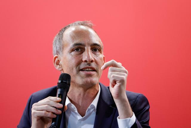(FILES) Co-president of French center-left party Place Publique (PP) Raphael Glucksmann delivers a speech during a gathering of the social-democratic left in Pontoise, north of Paris; on November 16, 2025. The primary will be without him. But the PS's last score in a national election was with him. Aware of this dilemma among the socialists, Raphael Glucksmann wants to convince them to abandon the primary of the unitarians in favour of a resolutely social-democratic ‘platform’. (Photo by GEOFFROY VAN DER HASSELT / AFP)