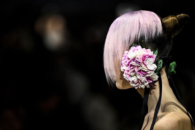 A model presents a creation for Christian Dior during the Women's Haute Couture Spring/Summer 2026 collection fashion show as part of the Paris Haute Couture Fashion Week, in Paris, on January 26, 2026. (Photo by JULIEN DE ROSA / AFP)
