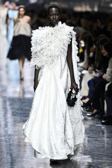 Model Nyaduola Gabriel presents a creation for Christian Dior during the Women's Haute Couture Spring/Summer 2026 collection fashion show as part of the Paris Haute Couture Fashion Week, in Paris, on January 26, 2026. (Photo by JULIEN DE ROSA / AFP)