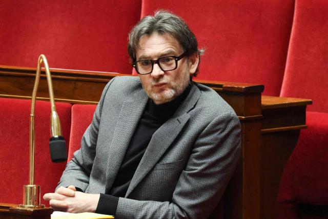 Les Democrates' MP Erwan Balanant attends a parliamentary debate on legislative process for a social media ban on under-15s at the Assemblee Nationale, France's lower house Parliament in Paris on January 26, 2026. French lawmakers are set to vote on draft legislation to ban social media for under-15s, an effort championed by President Emmanuel Macron as a way to protect children from excessive screen time. The legislation, which also provides for a ban on mobile phones in high schools, follows Australia banning social media for under-16s in December, a world first. As social media has grown around the world, so has concern that too much screen time is arresting child development and contributing to declining mental health in minors. (Photo by Ludovic MARIN / AFP)