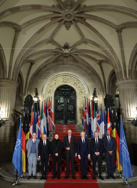 (L-R) Belgium's Prime Minister Bart de Wever, Luxemburg's Prime Minister Luc Frieden, Denmark's Prime Minister Mette Frederiksen, German Chancellor Friedrich Merz, Norway's Prime Minister Jonas Gahr Store and NATO's Deputy Secretary General for Cyber and Digital Transformation Jean-Charles Ellermann-Kingombe pose for a family photo during the North Sea Summit on January 26, 2026 at the City Hall of Hamburg, northern Germany. European leaders meet to discuss North Sea energy and security cooperation, but fears over US designs on the Arctic island of Greenland may overshadow the talks. The region has long worried about threats posed by Russia -- but more recently tensions have surged over US President Donald Trump's push for the autonomous territory of Denmark. (Photo by Ronny HARTMANN / AFP)