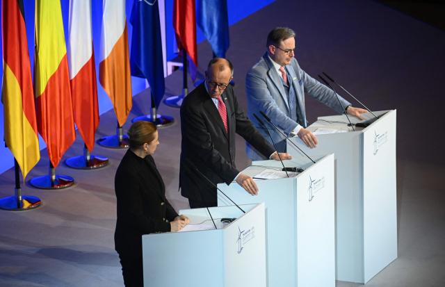 (L-R) Denmark's Prime Minister Mette Frederiksen, German Chancellor Friedrich Merz and Belgium's Prime Minister Bart de Wever address a press conference after signing the Hamburg declaration during the North Sea Summit on January 26, 2026 at the City Hall of Hamburg, northern Germany. European leaders meet to discuss North Sea energy and security cooperation, but fears over US designs on the Arctic island of Greenland may overshadow the talks. The region has long worried about threats posed by Russia -- but more recently tensions have surged over US President Donald Trump's push for the autonomous territory of Denmark. (Photo by Gregor Fischer / AFP)