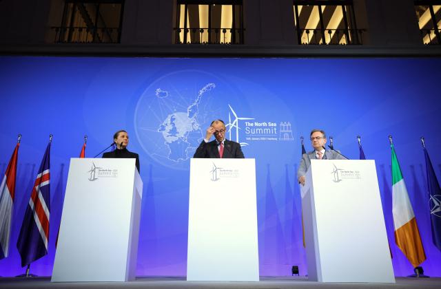 (L-R) Denmark's Prime Minister Mette Frederiksen, German Chancellor Friedrich Merz and Belgium's Prime Minister Bart de Wever address a press conference after signing the Hamburg declaration during the North Sea Summit on January 26, 2026 at the City Hall of Hamburg, northern Germany. European leaders meet to discuss North Sea energy and security cooperation, but fears over US designs on the Arctic island of Greenland may overshadow the talks. The region has long worried about threats posed by Russia -- but more recently tensions have surged over US President Donald Trump's push for the autonomous territory of Denmark. (Photo by Ronny HARTMANN / AFP)