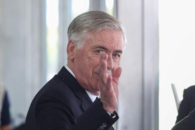 Brazil national team coach Carlo Ancelotti reacts after leaving a meeting with Brazil's President Luiz Inacio Lula da Silva at the Planalto Palace in Brasilia on January 26, 2026. The meeting addressed preparations and government guarantees for the 2027 FIFA Women's World Cup, which will be hosted exclusively by Brazil. The meeting strengthens cooperation between the Brazilian government and sports entities for the promotion of women's football in the country. (Photo by Sergio Lima / AFP)