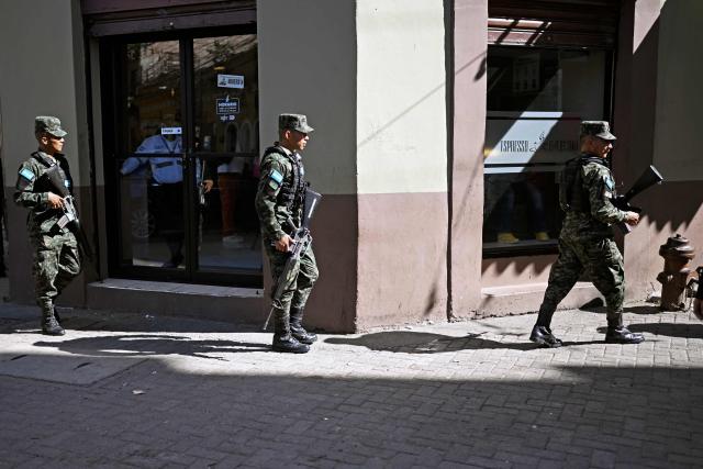 Honduran soldiers patrol the historic center of Tegucigalpa on January 26, 2026, ahead of the inauguration of President-elect Nasry Asfura. (Photo by JOHAN ORDONEZ / AFP)