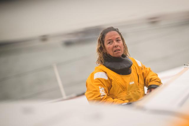 French skipper Alexia Barrier reacts as she and her crew sail towards the Brest harbour on the Ultim multihull Idec Sport after crossing the finish line of the Jules Verne Trophy, off the coast of Brest, Brittany, on January 26, 2026. French skipper Alexia Barrier (The Famous Project) and her six crew members completed on January 26, 2026, off the coast of Brest, the first non-stop round-the-world voyage in a maxi-trimaran with an all-female crew, her team announced. The Jules Verne Trophy is a prize for the fastest crewed, unassisted and non-stop circumnavigation of the world on any type of yacht. (Photo by Loic VENANCE / AFP)