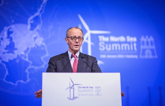 German Chancellor Friedrich Merz speaks at a press conference the heads of State signed the Hamburg declaration during the North Sea Summit on January 26, 2026 at the City Hall of Hamburg, northern Germany. European leaders meet to discuss North Sea energy and security cooperation, but fears over US designs on the Arctic island of Greenland may overshadow the talks. The region has long worried about threats posed by Russia -- but more recently tensions have surged over US President Donald Trump's push for the autonomous territory of Denmark. (Photo by Ronny HARTMANN / AFP)