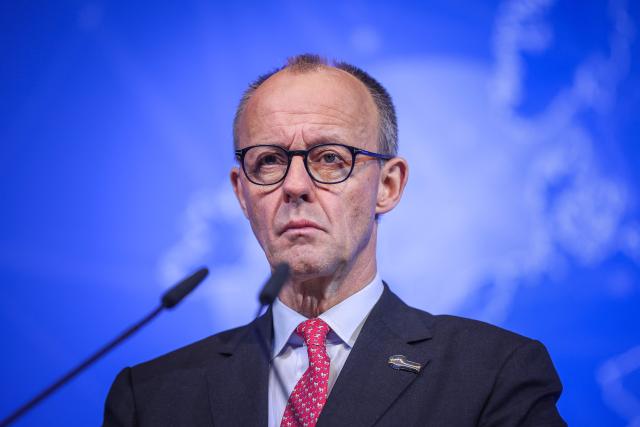 German Chancellor Friedrich Merz speaks at a press conference the heads of State signed the Hamburg declaration during the North Sea Summit on January 26, 2026 at the City Hall of Hamburg, northern Germany. European leaders meet to discuss North Sea energy and security cooperation, but fears over US designs on the Arctic island of Greenland may overshadow the talks. The region has long worried about threats posed by Russia -- but more recently tensions have surged over US President Donald Trump's push for the autonomous territory of Denmark. (Photo by Ronny HARTMANN / AFP)