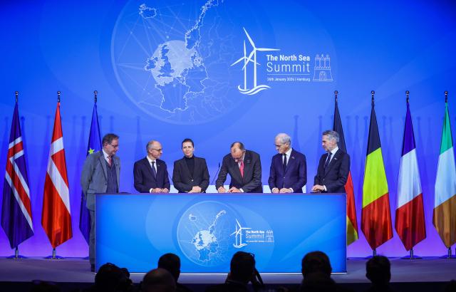 Belgium's Prime Minister Bart de Wever, Luxemburg's Prime Minister Luc Frieden, Denmark's Prime Minister Mette Frederiksen, German Chancellor Friedrich Merz, Norway's Prime Minister Jonas Gahr Store and Netherland's Prime Minister Dick Schoof sign the Hamburg declaration during the North Sea Summit on January 26, 2026 at the City Hall of Hamburg, northern Germany. European leaders meet to discuss North Sea energy and security cooperation, but fears over US designs on the Arctic island of Greenland may overshadow the talks. The region has long worried about threats posed by Russia -- but more recently tensions have surged over US President Donald Trump's push for the autonomous territory of Denmark. (Photo by Ronny HARTMANN / AFP)