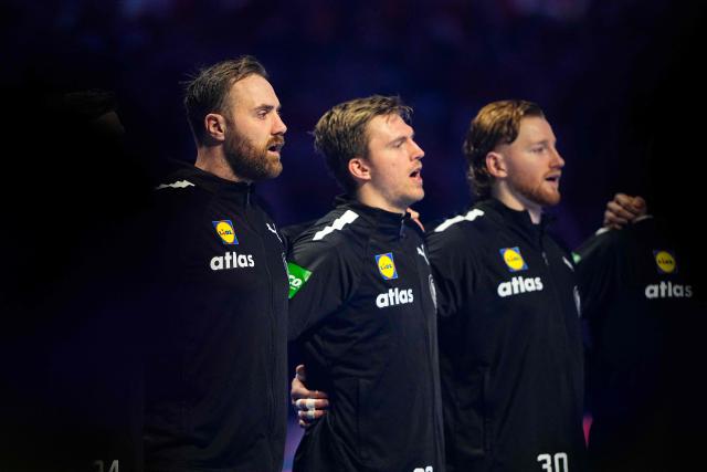 Germany's players sing the national anthem prior to the men's EHF Euro 2026 main round handball match Germany vs Denmark in Herning, Denmark, on January 26, 2026. (Photo by Bo Amstrup / Ritzau Scanpix / AFP) / Denmark OUT