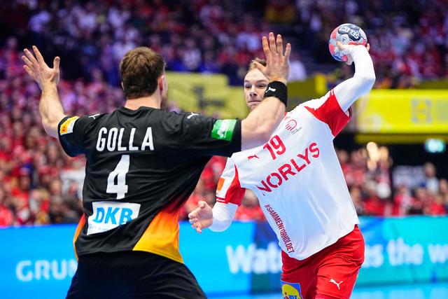Germany's pivot #04 Johannes Golla and Denmark's right back #19 Mathias Gidsel vie for the ball during the men's EHF Euro 2026 main round handball match Germany vs Denmark in Herning, Denmark, on January 26, 2026. (Photo by Bo Amstrup / Ritzau Scanpix / AFP) / Denmark OUT