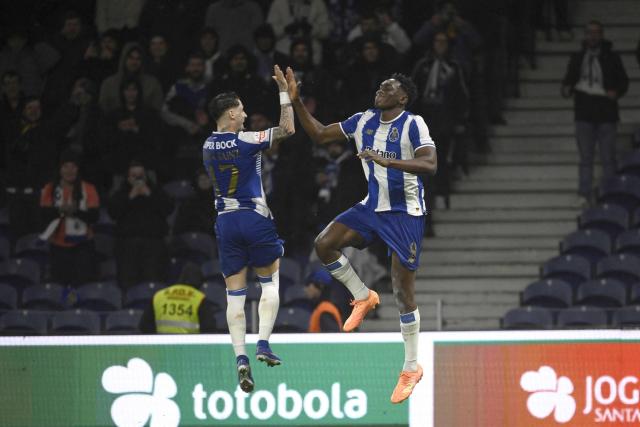 FC Porto's Spanish forward #09 Samuel Omorodion celebrates scoring his team's first goal from the penalty spot with FC Porto's Spanish forward #17 Borja Sainz during the Portuguese League football match between FC Porto and Gil Vicente FC at Dragao stadium in Porto, on January 26, 2026. (Photo by Miguel RIOPA / AFP)