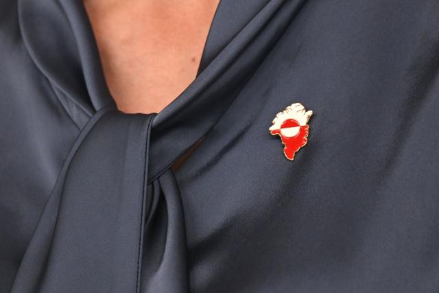 Anna Wangenheim, Minister for Health and for Persons with Disabilities, wears a pin with the map of Greenland during a press conference near then town hall in the city of Nuuk, western Greenland, on January 26, 2026. (Photo by Ina FASSBENDER / AFP)
