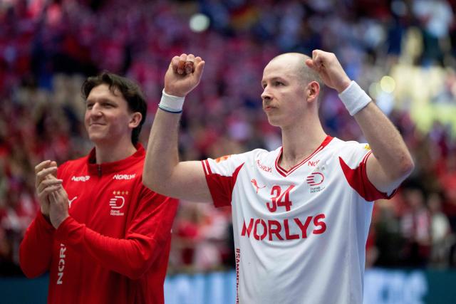Denmark's left back #64 Lasse Moller Moeller and  Denmark's pivot #34 Simon Hald Jensen celebrate after the men's EHF Euro 2026 main round handball match Germany vs Denmark in Herning, Denmark, on January 26, 2026. (Photo by Bo Amstrup / Ritzau Scanpix / AFP) / Denmark OUT