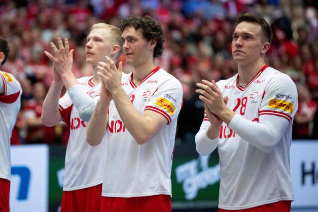 Denmark's pivot #15 Magnus Saugstrup, Denmark's right back #03 Niclas Kirkelokke and Denmark's left back #28 Lasse Andersson celebrate the victory with the fans after during the men's EHF Euro 2026 main round handball match Germany vs Denmark in Herning, Denmark, on January 26, 2026. (Photo by Bo Amstrup / Ritzau Scanpix / AFP) / Denmark OUT