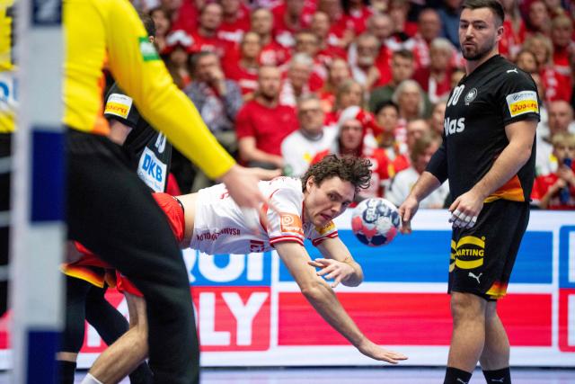 Denmark's right back #03 Niclas Kirkelokke watches the ball during the men's EHF Euro 2026 main round handball match between Germany and Denmark at the at Jyske Bank Boxen Arena in Herning, Denmark, on January 26, 2026. (Photo by Bo Amstrup / Ritzau Scanpix / AFP) / Denmark OUT