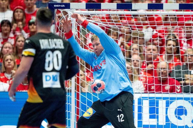 Denmark's goalkeeper #12 Emil Nielsen stretches to save the ball during the men's EHF Euro 2026 main round handball match between Germany and Denmark at the at Jyske Bank Boxen Arena in Herning, Denmark, on January 26, 2026. (Photo by Bo Amstrup / Ritzau Scanpix / AFP) / Denmark OUT