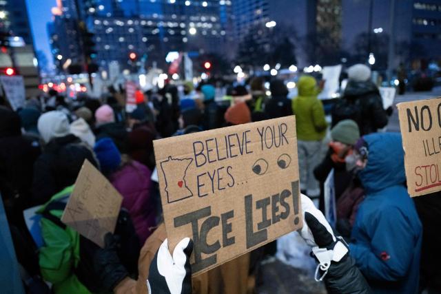 Demonstrators gather to protest against US Immigration and Customs Enforcement (ICE) outside the state office of US Senator Amy Klobuchar, Democrat of Minnesota, following last week fatal shooting of 37-year-old ICU nurse Alex Pretti by federal immigration agents, in Minneapolis, Minnesota, on January 26, 2026. On January 24, federal agents shot and killed Alex Pretti, a 37-year-old ICU nurse, while scuffling with him on an icy roadway in Minneapolis, less than three weeks after an immigration officer fired on Renee Good, also 37, killing her in her car. US President Donald Trump blamed their deaths on Democratic "chaos," as his administration faced intensifying pressure over its mass immigration crackdown in Minneapolis. (Photo by ROBERTO SCHMIDT / AFP)