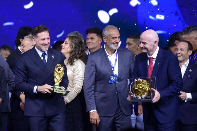 FIFA President Gianni Infantino (R) and CONMEBOL President Alejandro Dominguez (L) attend a commemorative event marking the 10th anniversary of Dominguez's work as the head of the South American Football Confederation in Luque, Paraguay on January 26, 2026. (Photo by Daniel DUARTE / AFP)