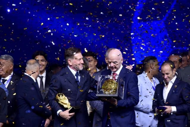 FIFA President Gianni Infantino (R) and CONMEBOL President Alejandro Dominguez (L) attend a commemorative event marking the 10th anniversary of Dominguez's work as the head of the South American Football Confederation in Luque, Paraguay on January 26, 2026. (Photo by Daniel DUARTE / AFP)