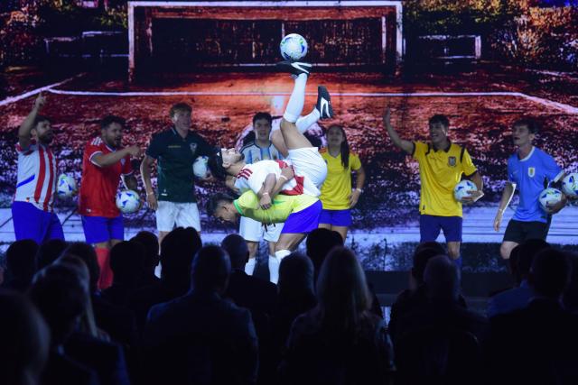 Freestyle footballers perform a show during a commemorative event marking the 10th anniversary of CONMEBOL President Alejandro Dominguez's work as the head of the South American Football Confederation in Luque, Paraguay on January 26, 2026. (Photo by Daniel DUARTE / AFP)