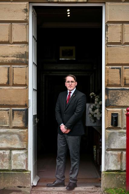 This photo taken on January 16, 2026 shows head butler Stuart Banks posing for a photo at Dumfries House, headquarters of the King's Foundation near Cumnock, south of Glasgow, Scotland. The 2,000-acre estate is the headquarters of the King's Foundation and at the heart of a new Amazon Prime documentary "Finding Harmony: A King's Vision" which is set to premiere on January 28. (Photo by Andy BUCHANAN / AFP) / TO GO WITH Britain-royals-environment-climate-charity-education, REPORTAGE by Akshata KAPOOR